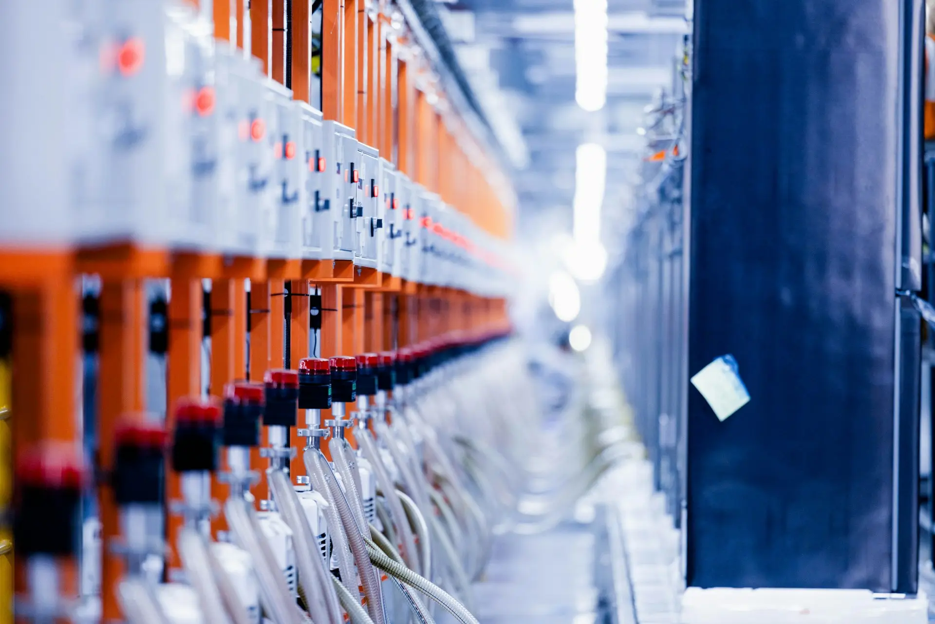 a row of orange and white electrical wires